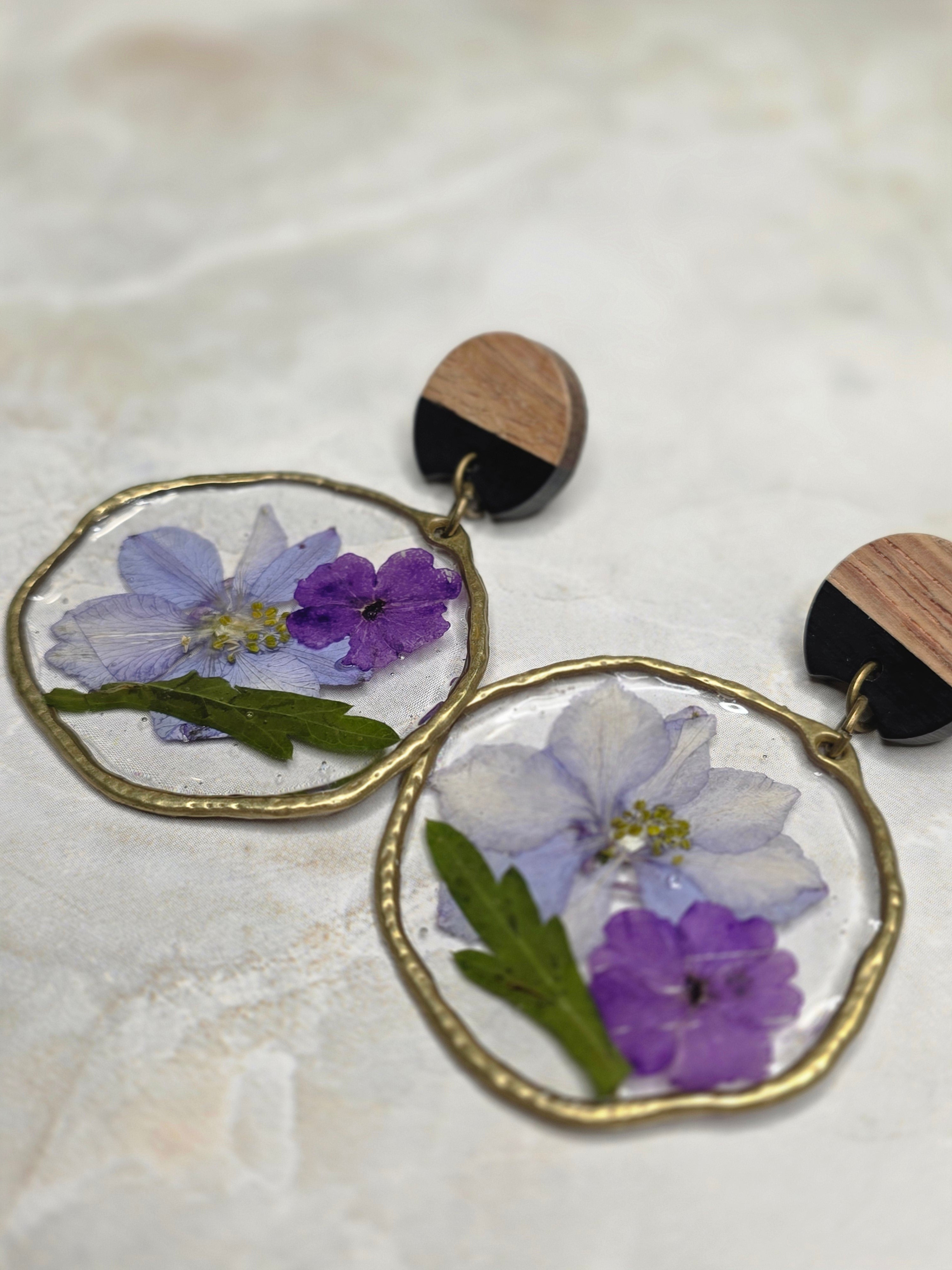 Earrings with floral designs on a light background